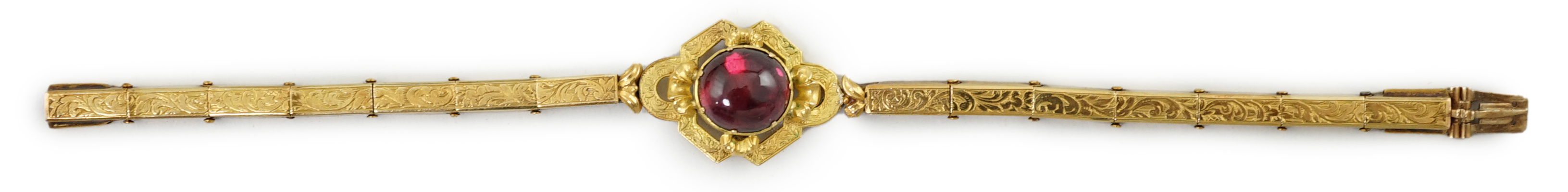 An early 19th century engraved gold and cabochon garnet set mourning bracelet